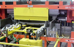 Die with an In-Die Transfer for Rolled Formed Bumpers